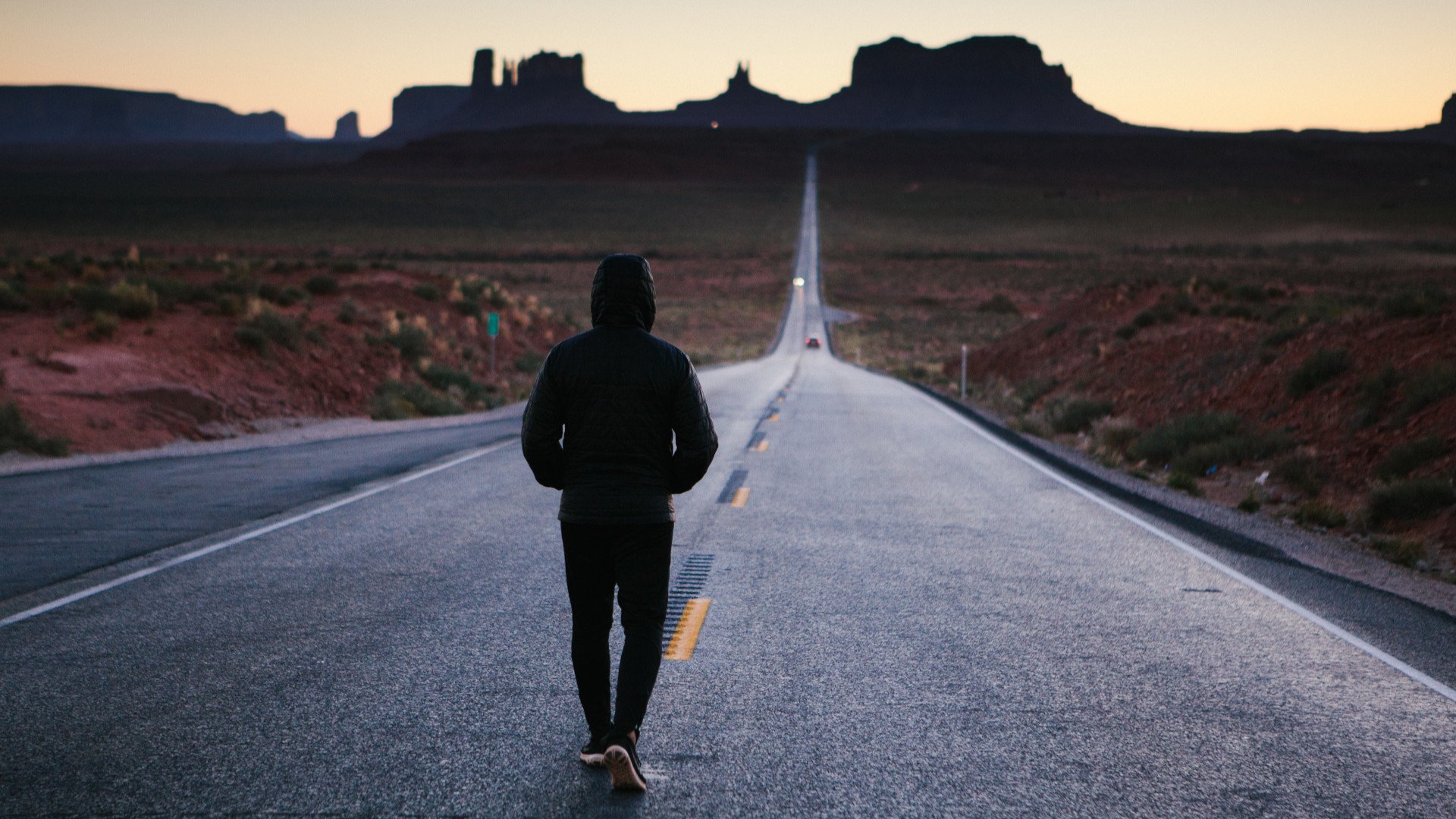 hooded man walking