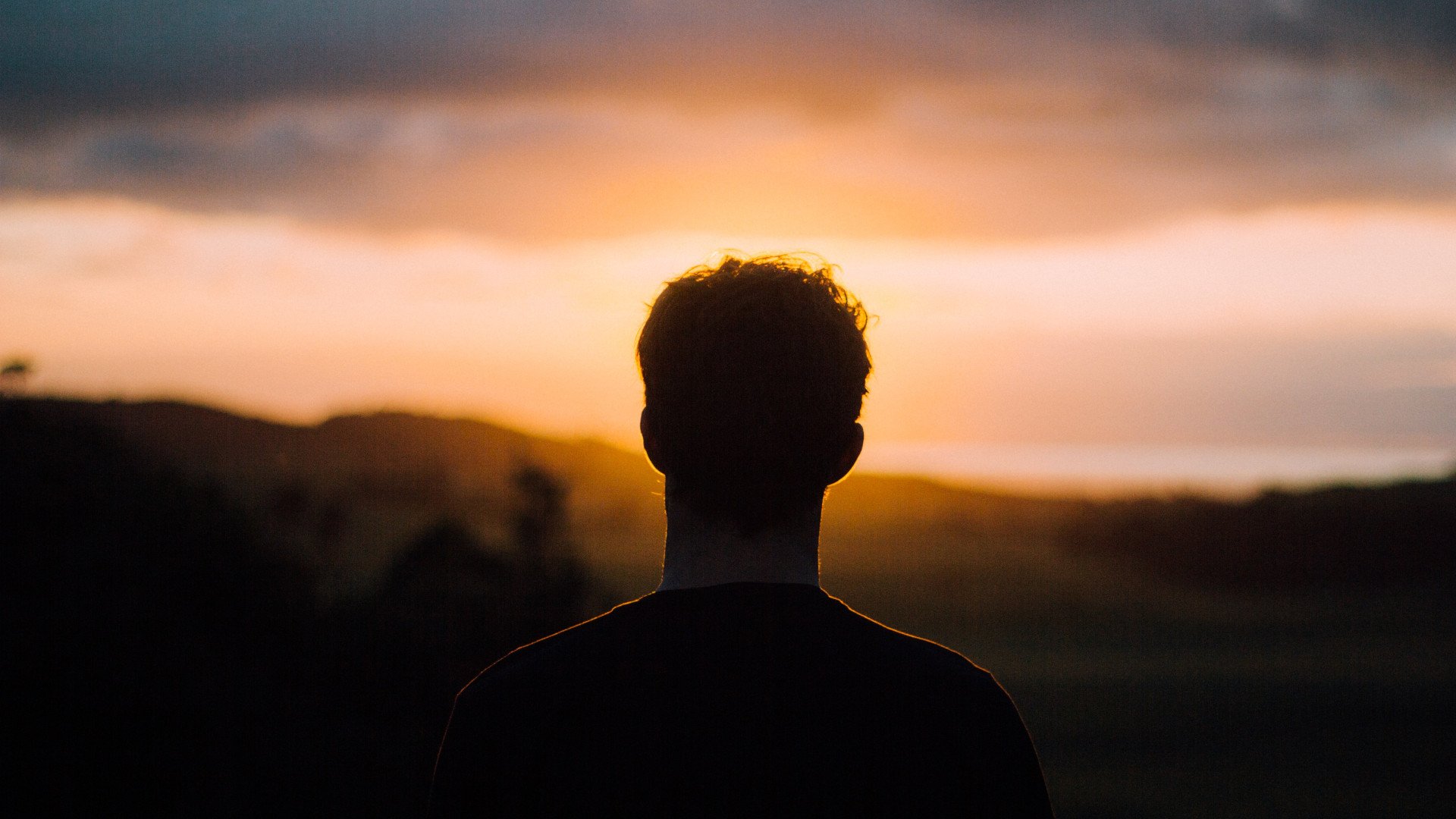 lonely man looking at the sky