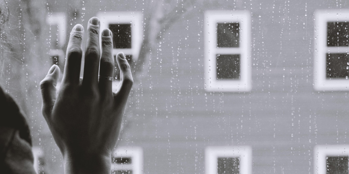 a hand touching the window