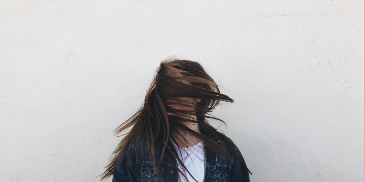 woman flexing her hair