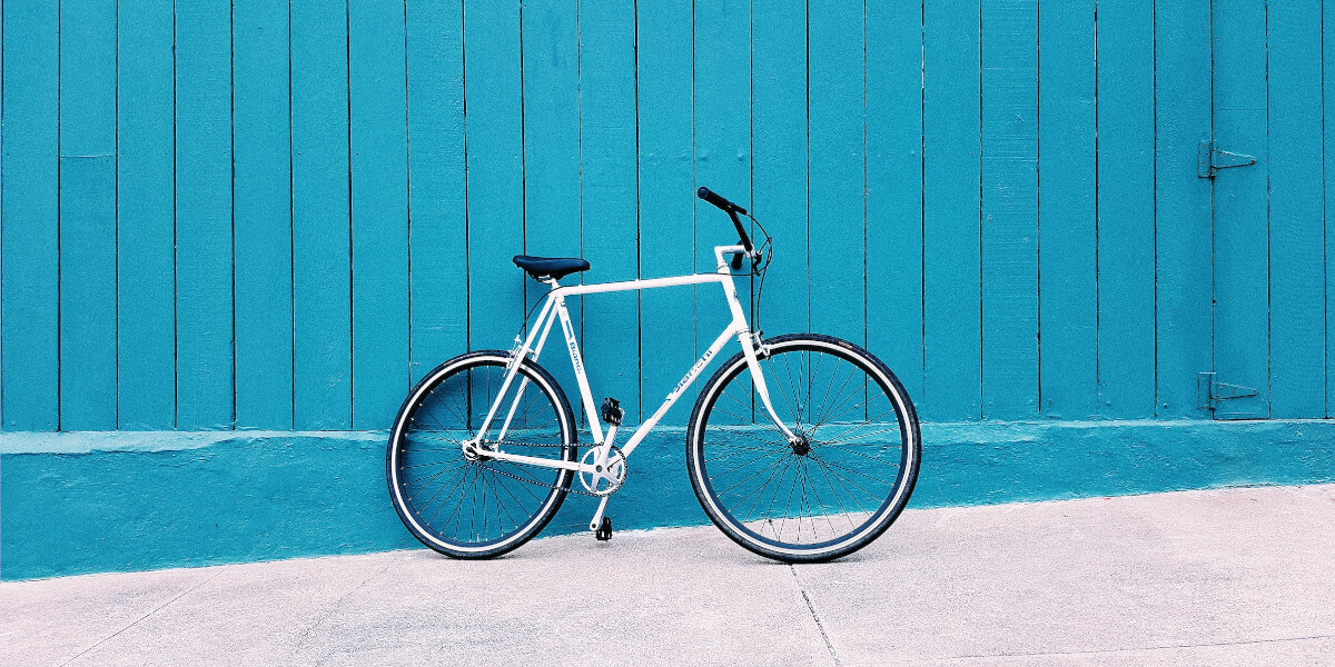 a bike beside a blue wall