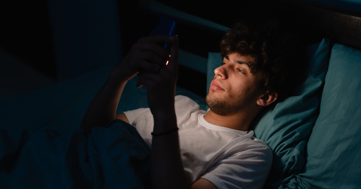 reclined man scowling at phone